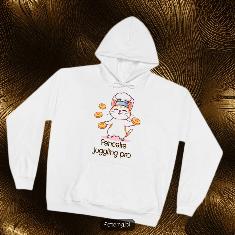 Funny hoodie with a cat chef juggling airborne pancakes, designed for culinary enthusiasts and cat lovers.