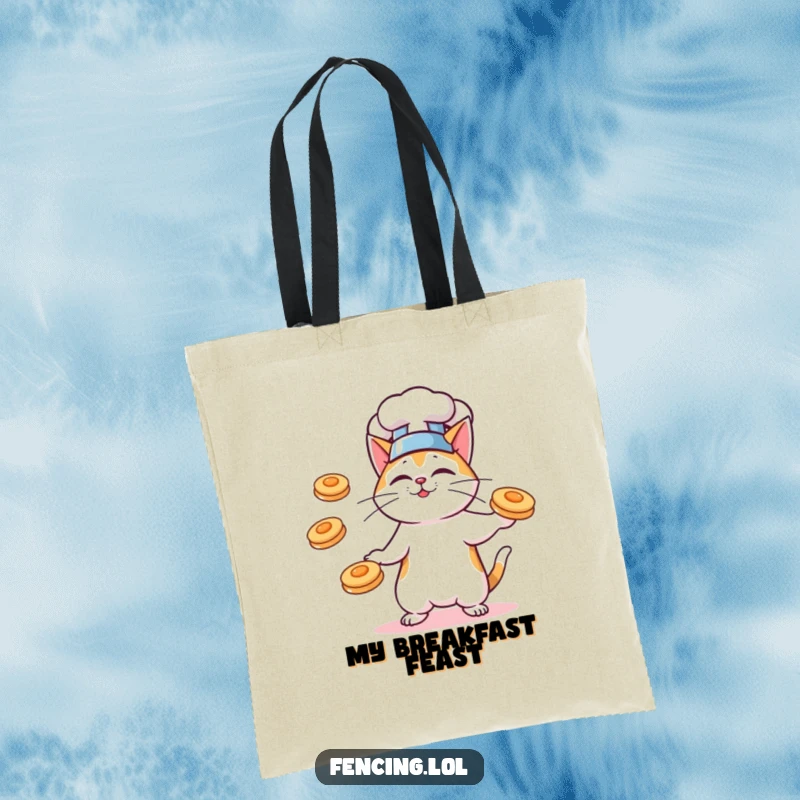 Funny tote bag with a cat chef juggling pancakes, ideal for carrying groceries or kitchen essentials.
